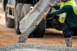 construction-worker-pouring-wet-concret-road-construction-site